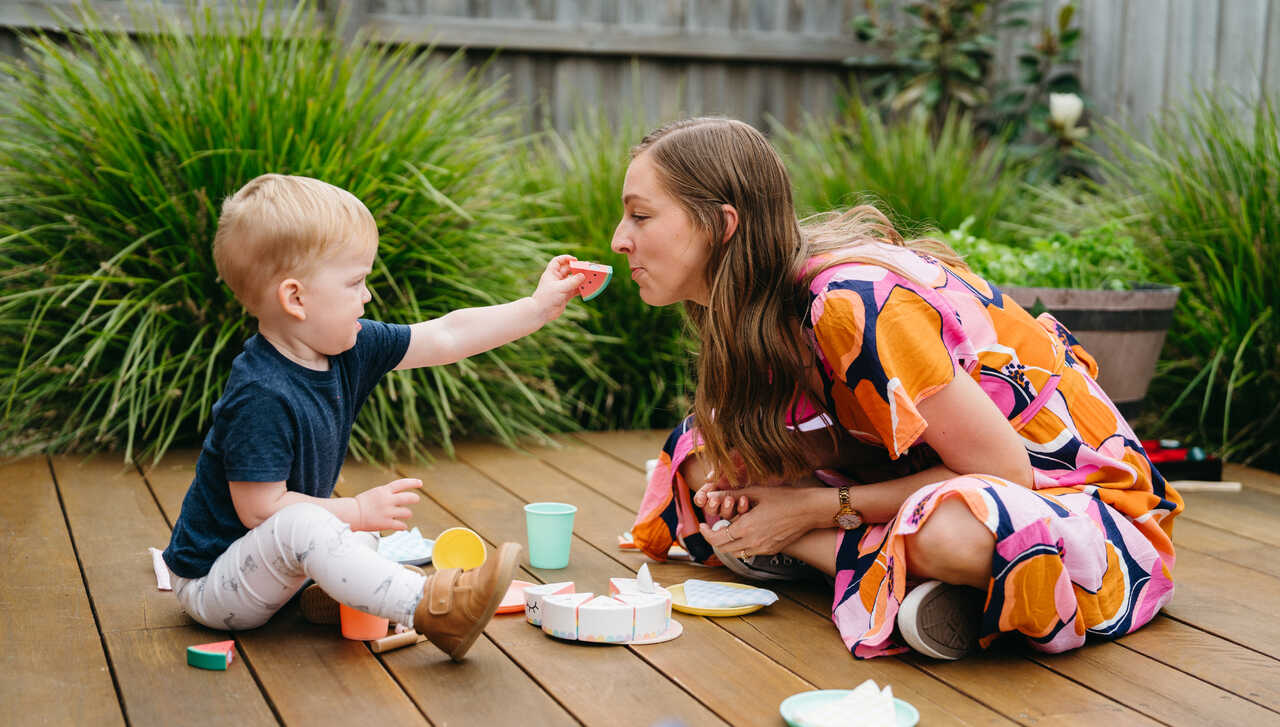 Learner play feeds behaviour therapist wooden fruit