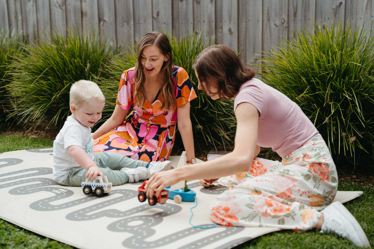 Behaviour technicians follow childs lead playing cars